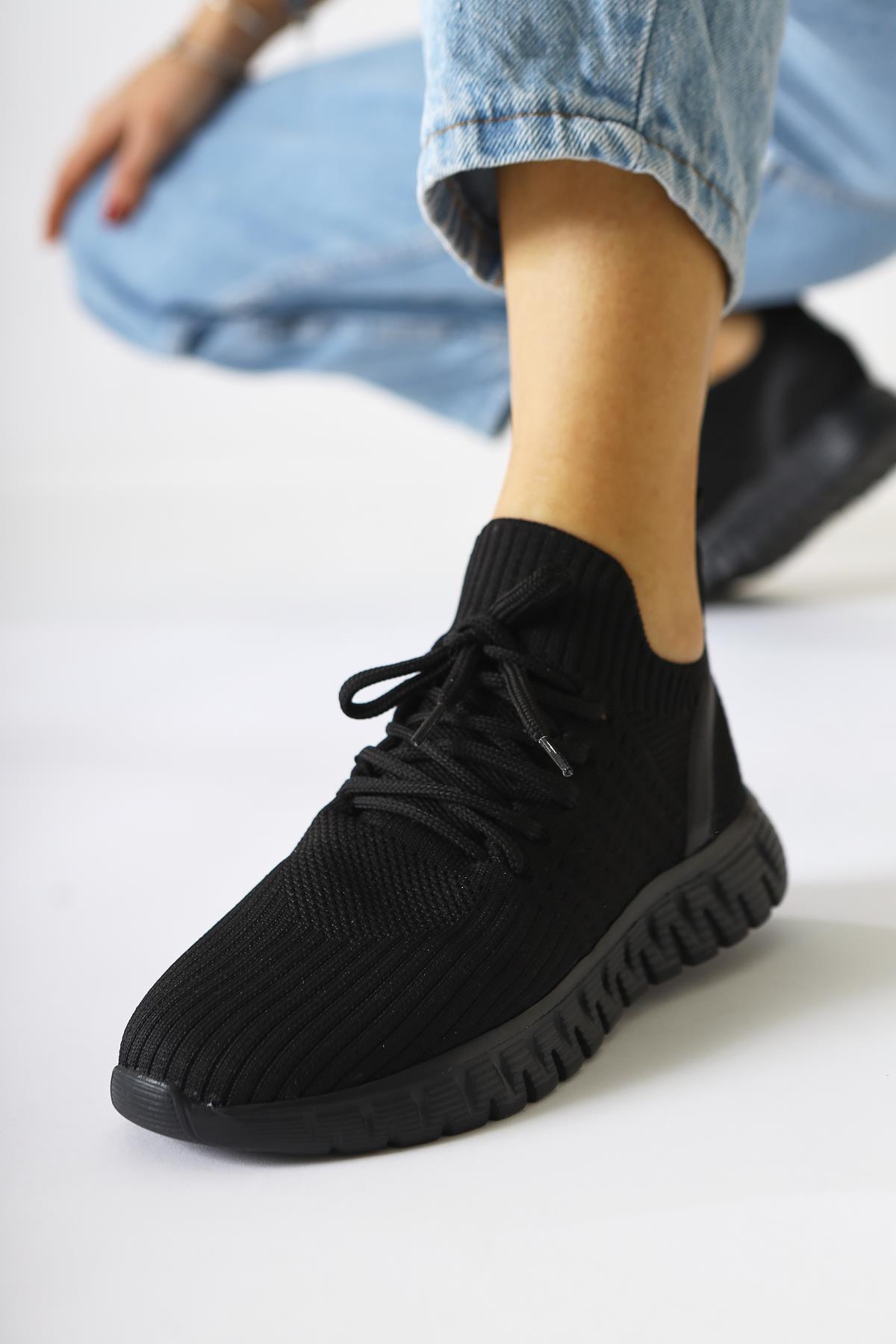 Astera – Black Lace-Up Woven Sneaker (Women)
