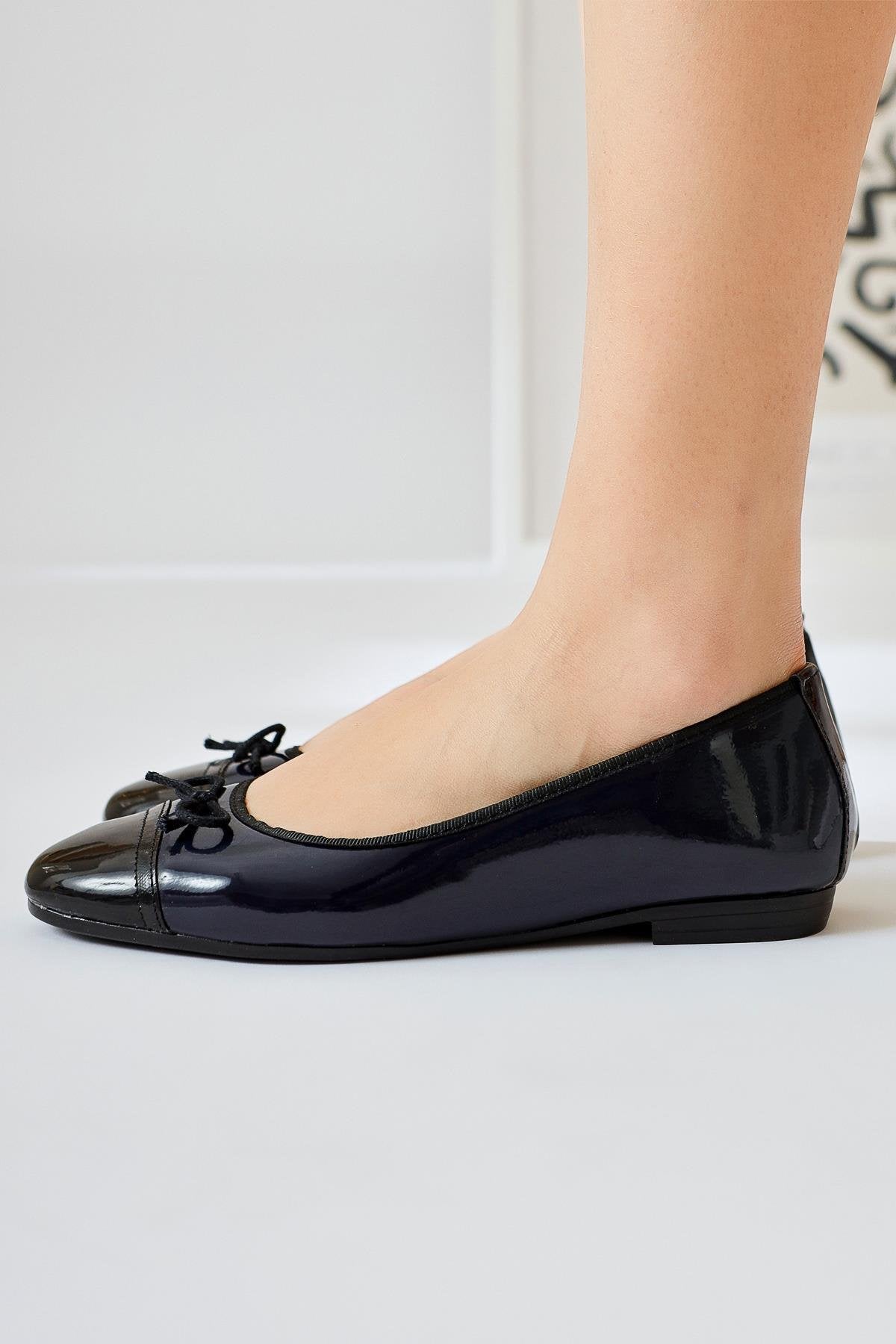 Sobhie Navy Patent Leather Flat with Black Toe and Bow Detail