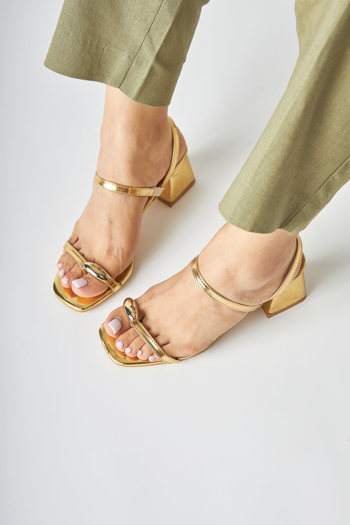 Selenya - Gold Buckle-Detail Toe-Post Sandal (Women)