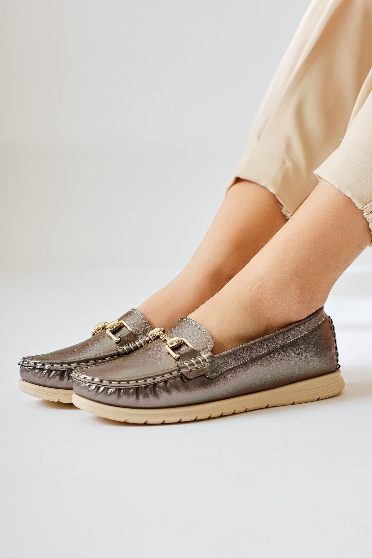 Tola – Platinum Buckle-Detail Shoe (Women)