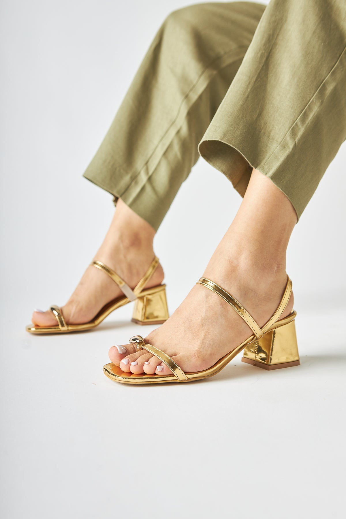 Selenya - Gold Buckle-Detail Toe-Post Sandal (Women)