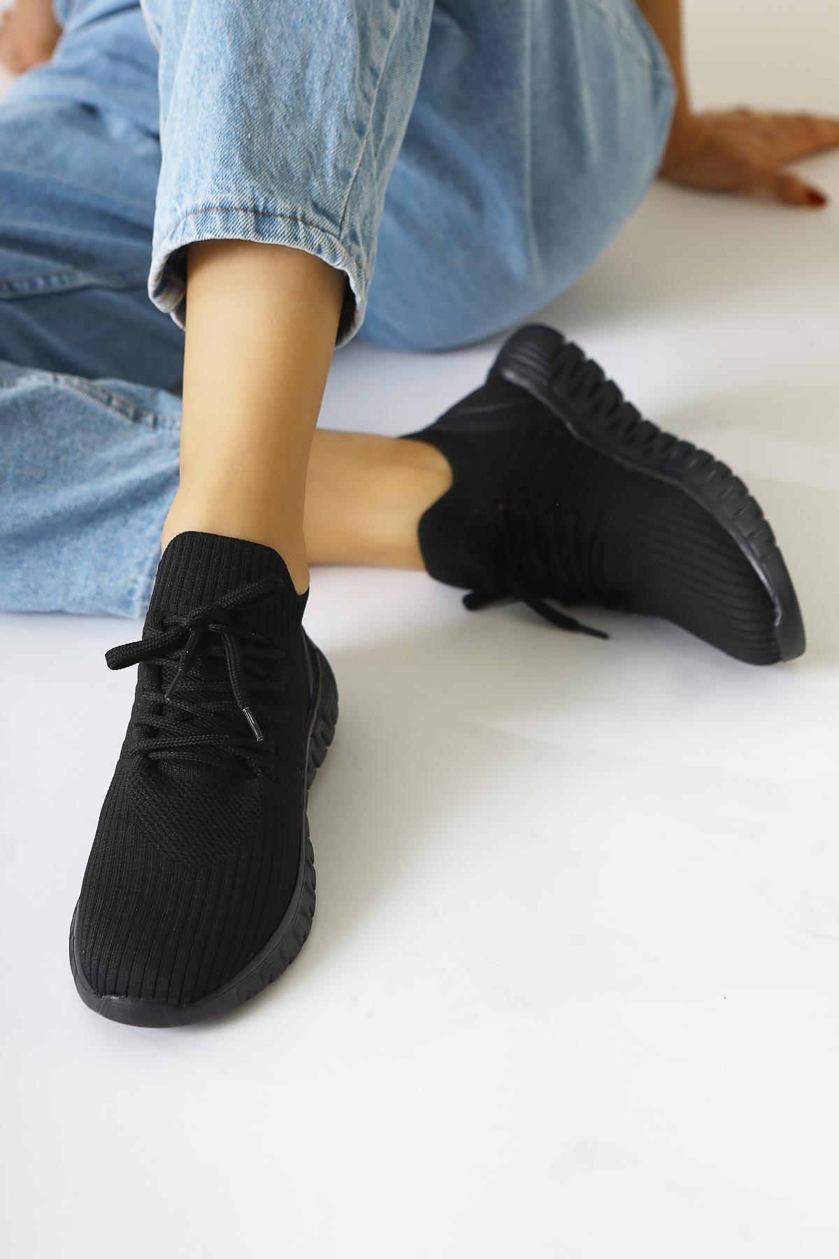 Astera – Black Lace-Up Woven Sneaker (Women)