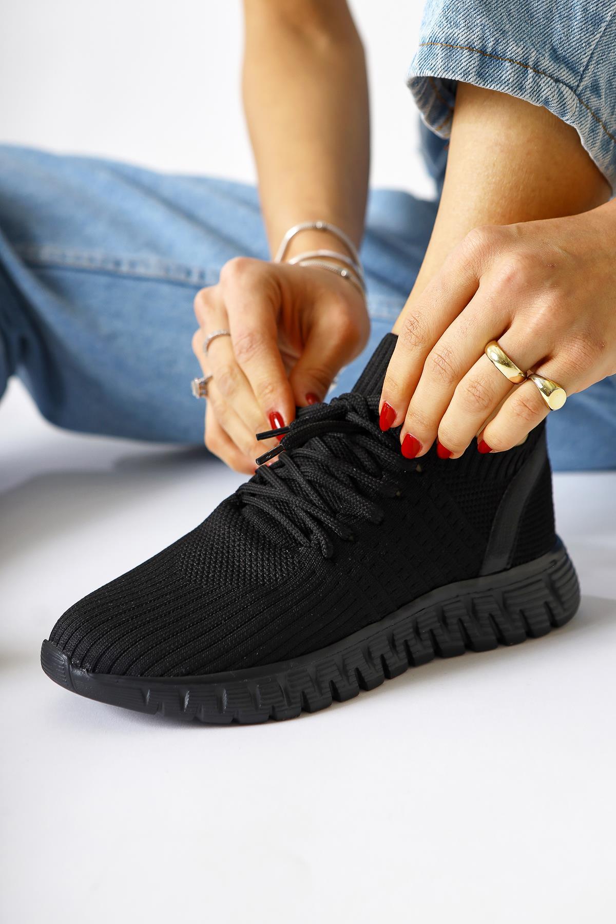 Astera – Black Lace-Up Woven Sneaker (Women)