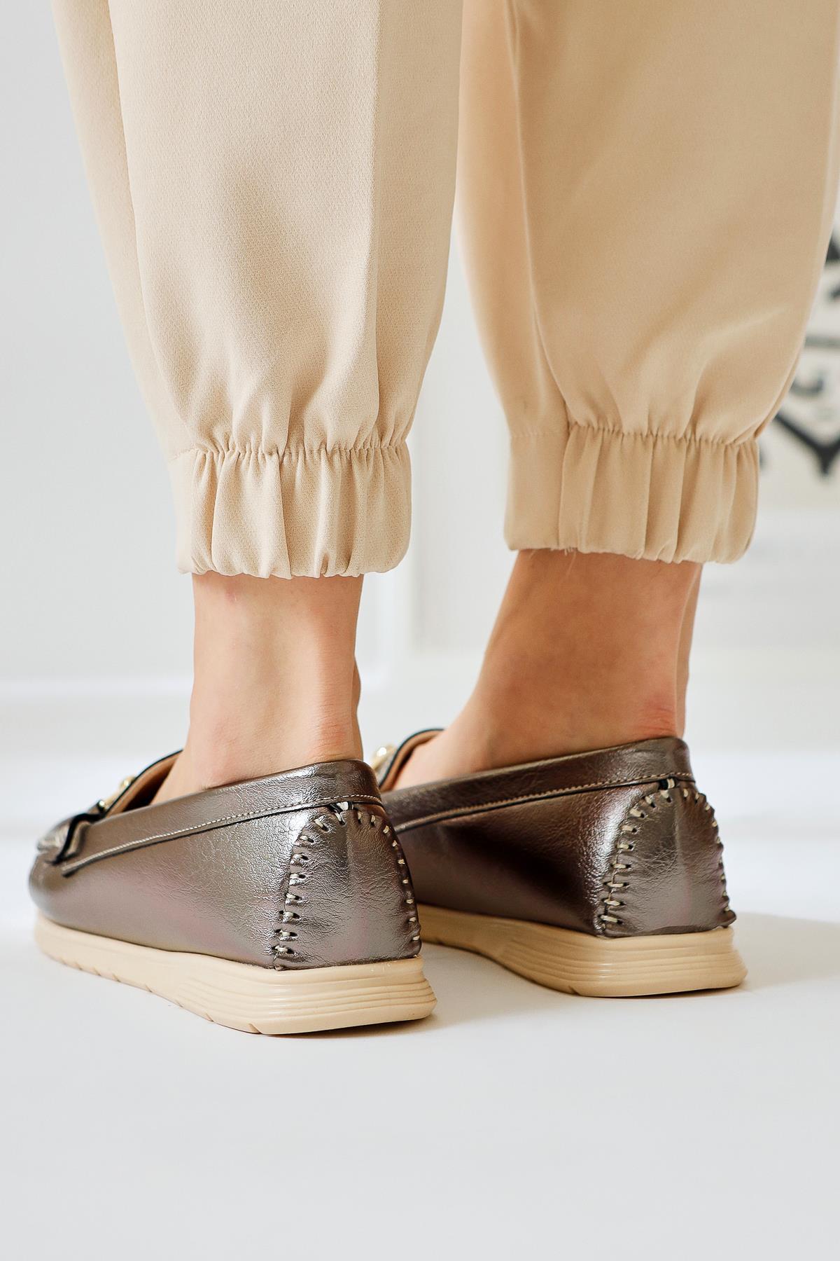 Tola – Platinum Buckle-Detail Shoe (Women)