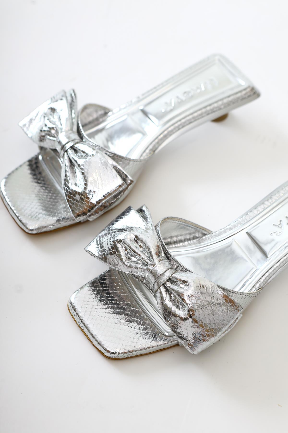 Juvy Glossy Silver Snake Skin Textured Bow Slippers