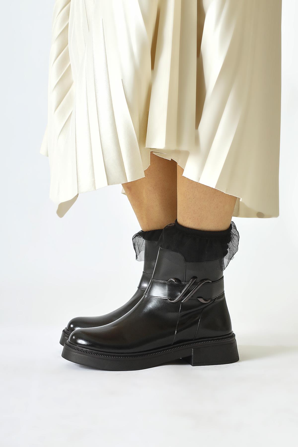 Birta – Black Patent Buckle-Detail Oval-Toe Boot (Women)