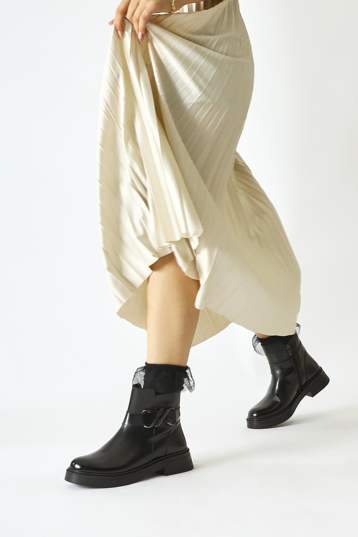 Birta – Black Patent Buckle-Detail Oval-Toe Boot (Women)