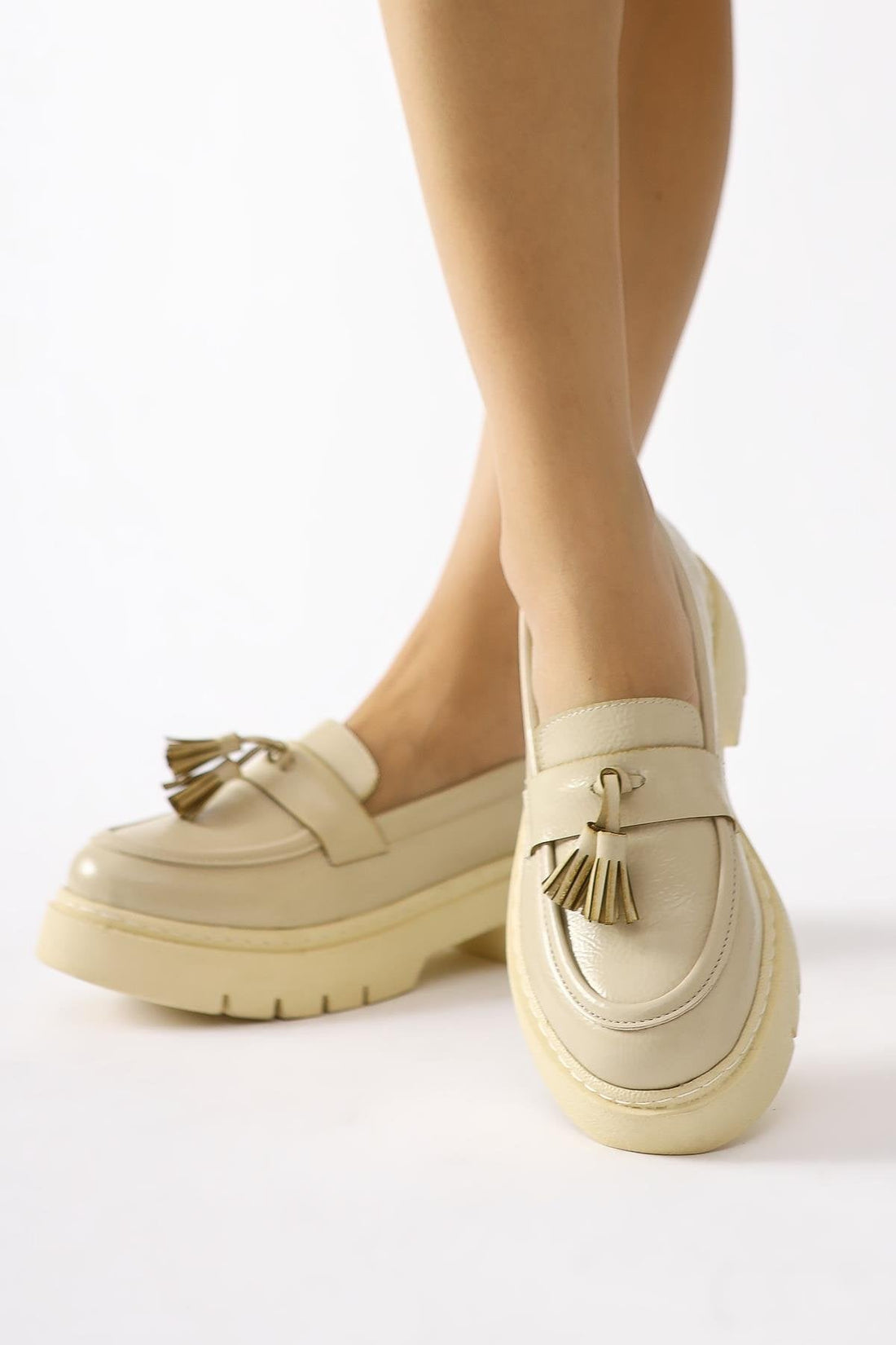 Linni Nude Crinkled Patent Leather Moccasins with Tassels