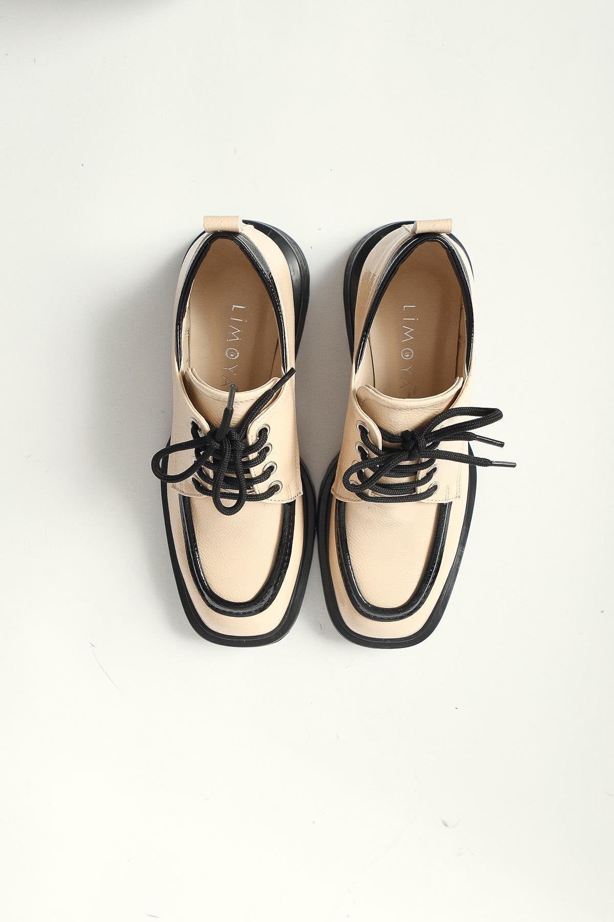 Niven – Beige Crinkled Patent Black-Detail Loafer (Women)