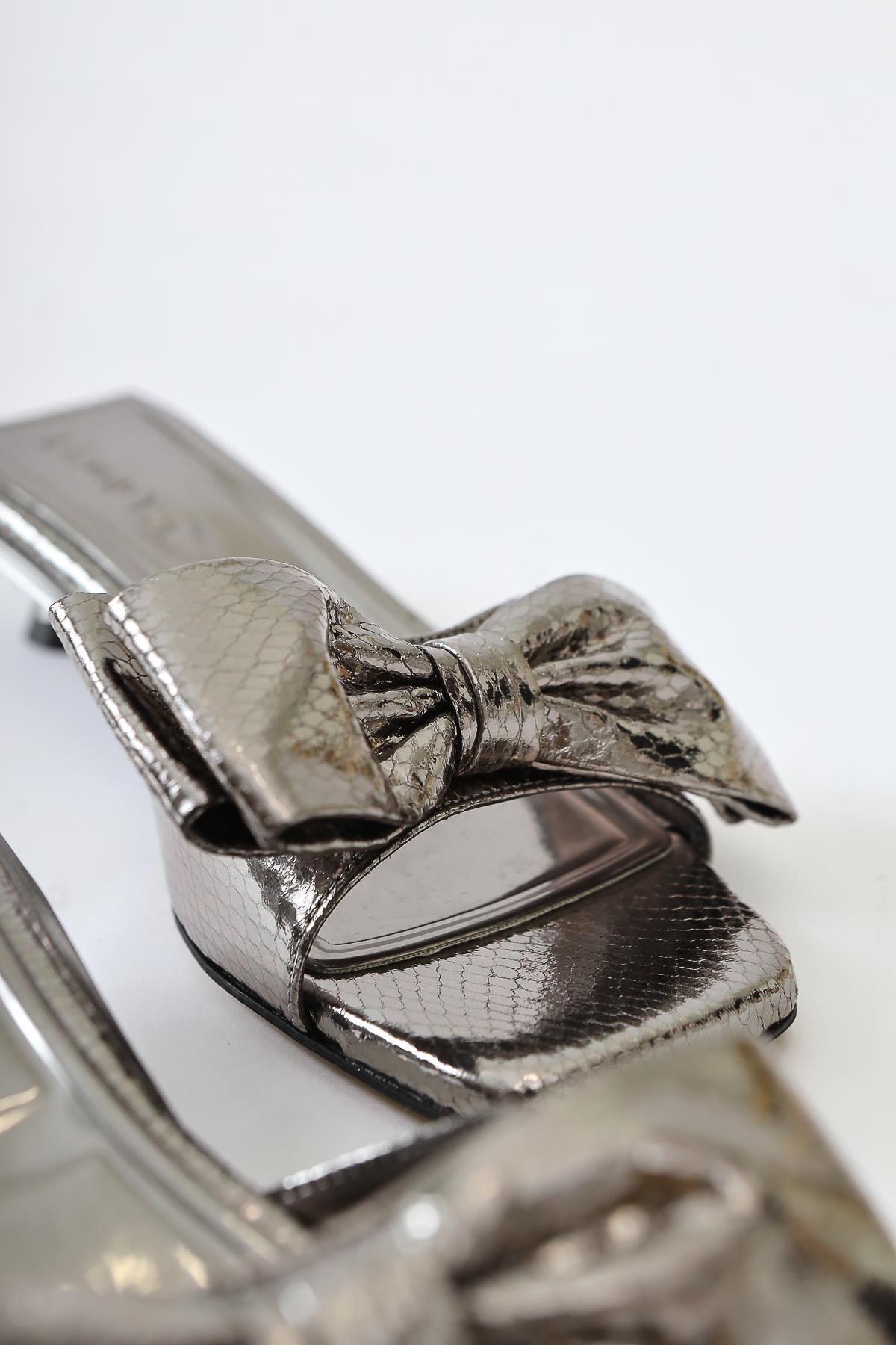 Juvy Glossy Platinum Snake Skin Textured Bow Slippers