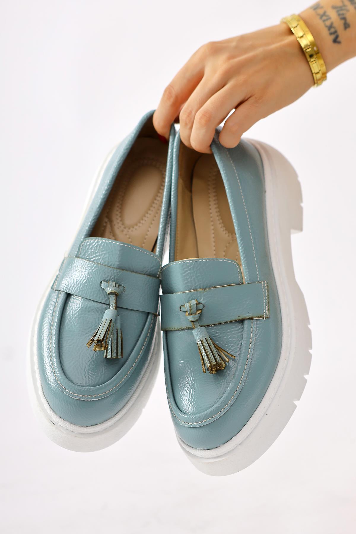 Linni Turquoise Crinkled Patent Leather Moccasins with Tassels