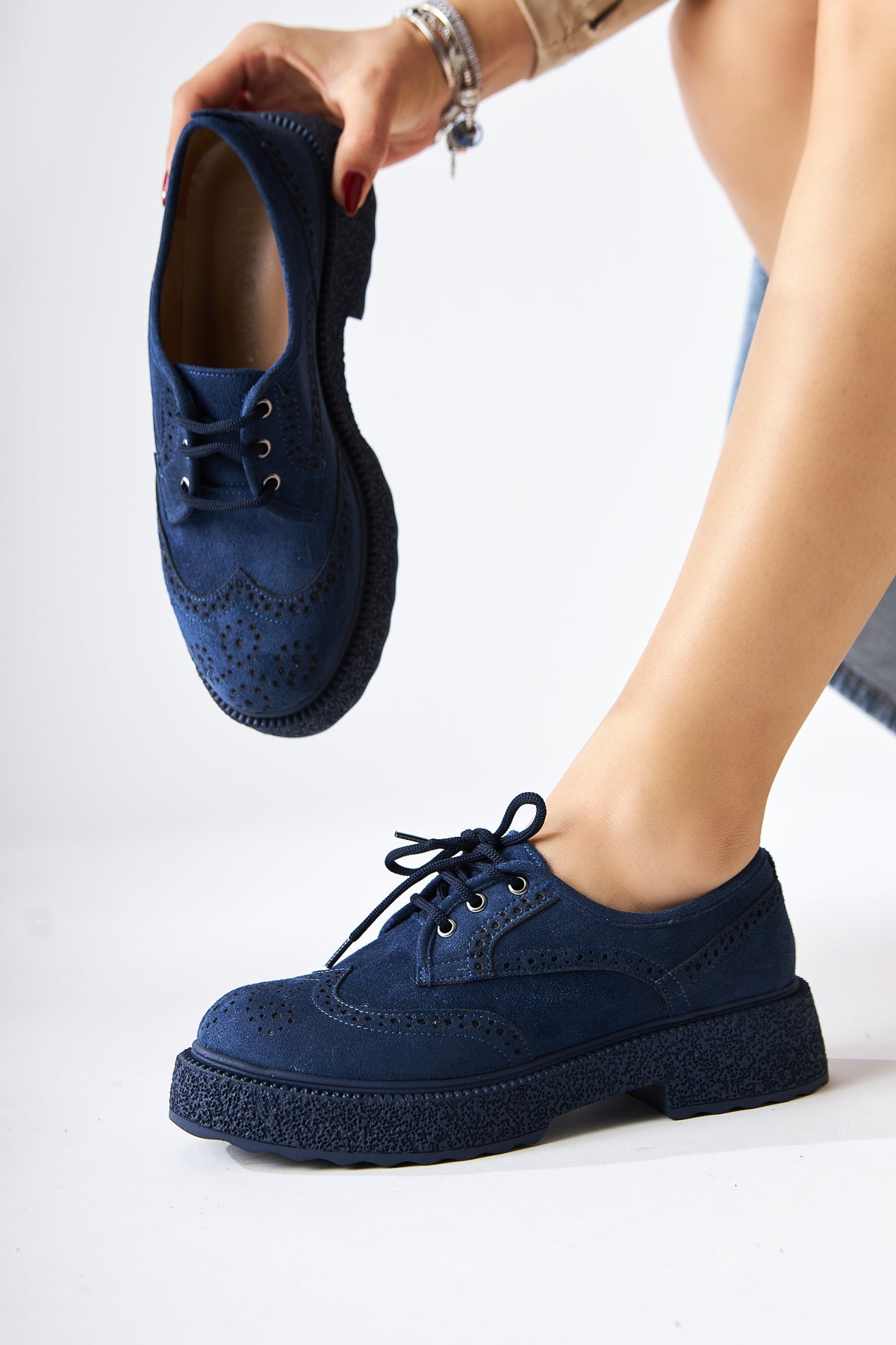 Rossy – Navy Suede Laser-Cut Oval-Toe Shoe (Women)