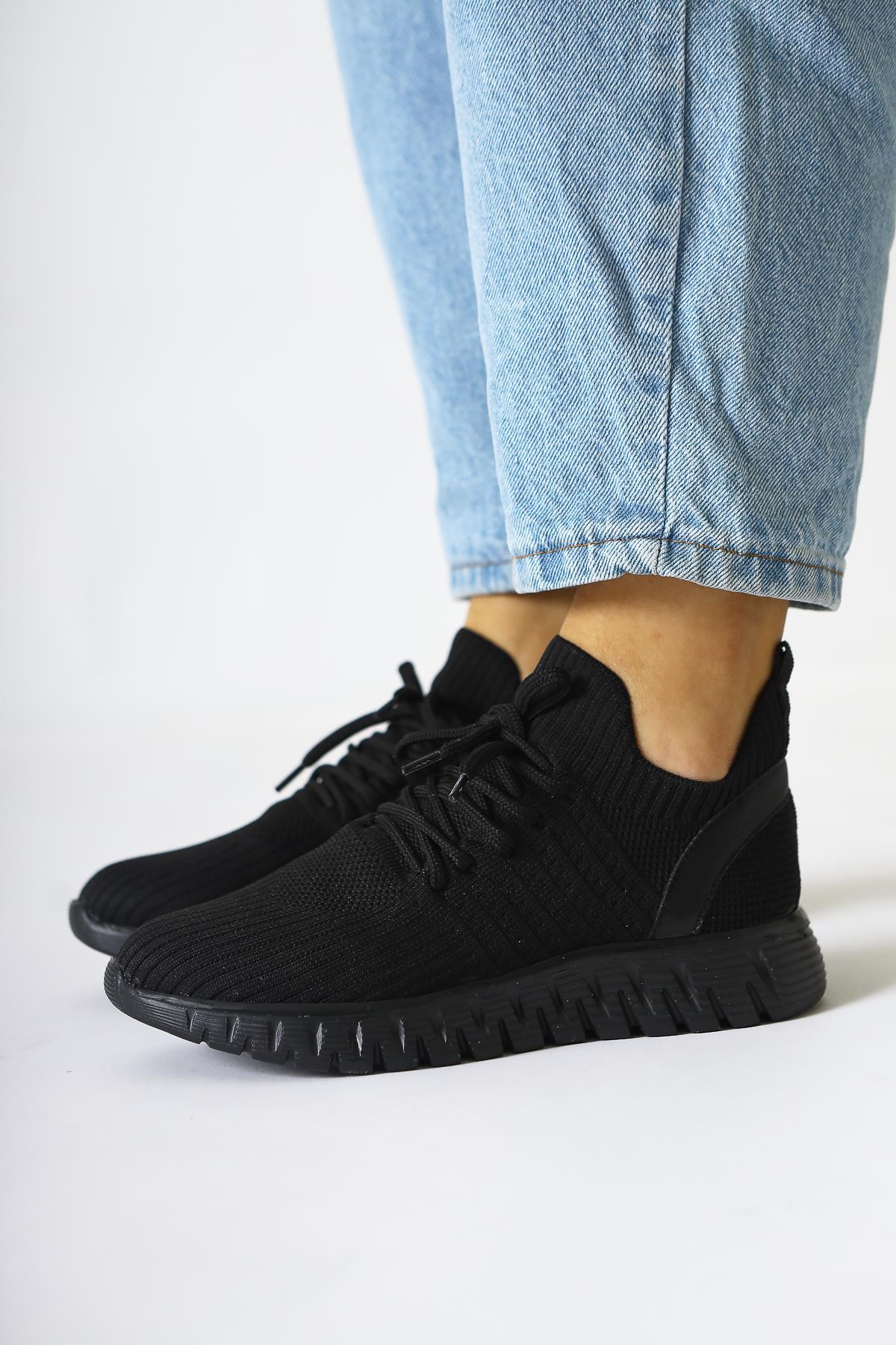 Astera – Black Lace-Up Woven Sneaker (Women)